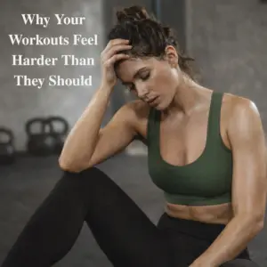 Woman sitting on a gym floor after a workout, appearing fatigued and overwhelmed, representing how high cortisol and hormonal imbalance can make exercise feel harder than it should.
